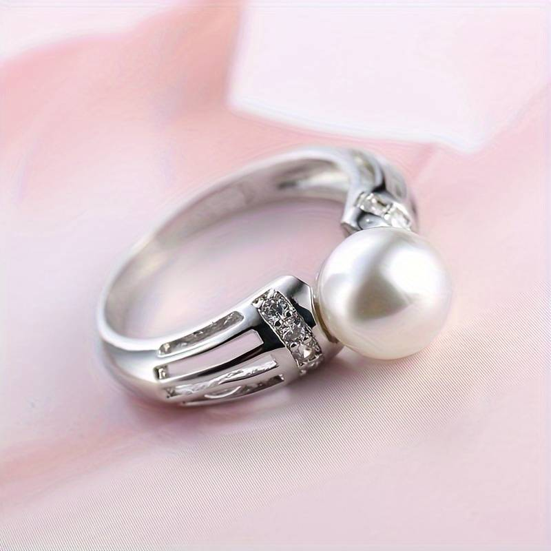 Bague vintage avec perle en or blanc
