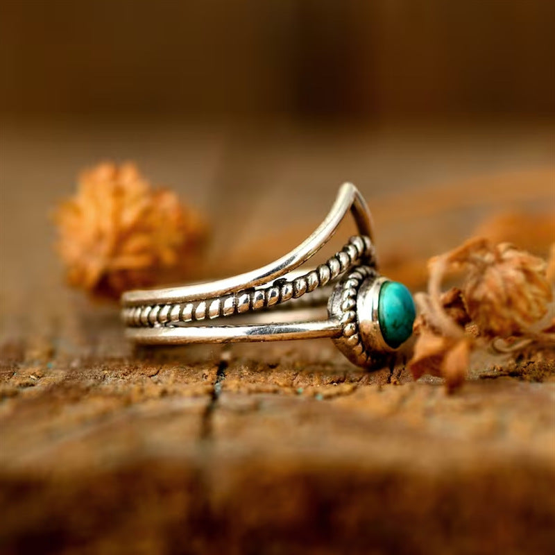 Bague avec perles turquoises en or