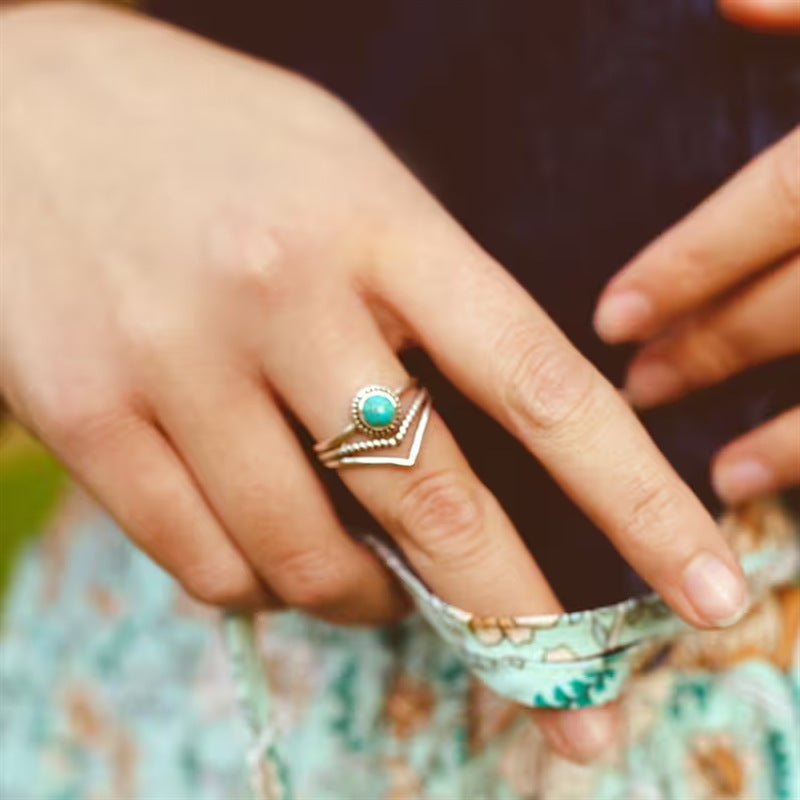 Bague avec perles turquoises en or