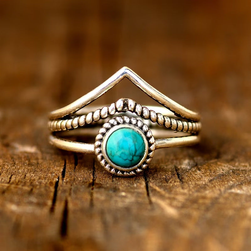 Bague avec perles turquoises en or