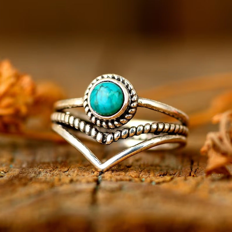 Bague avec perles turquoises en or