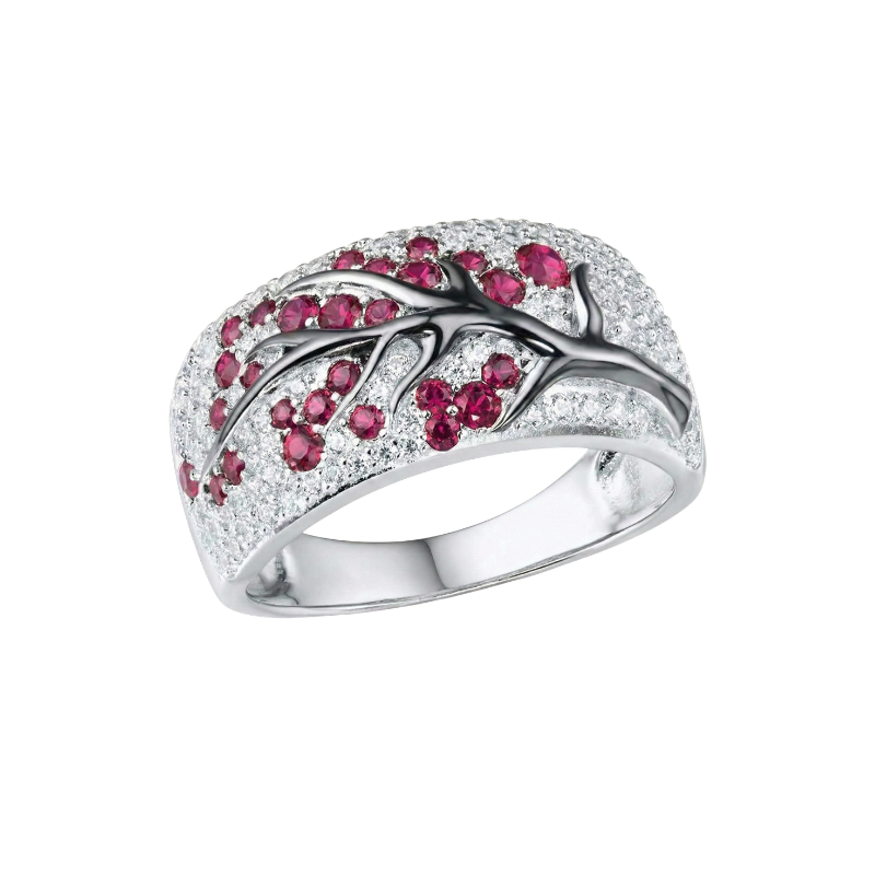 Bague avec rubis et fleurs en or blanc