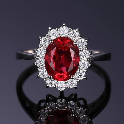 Bague classique avec rubis et bord en or blanc