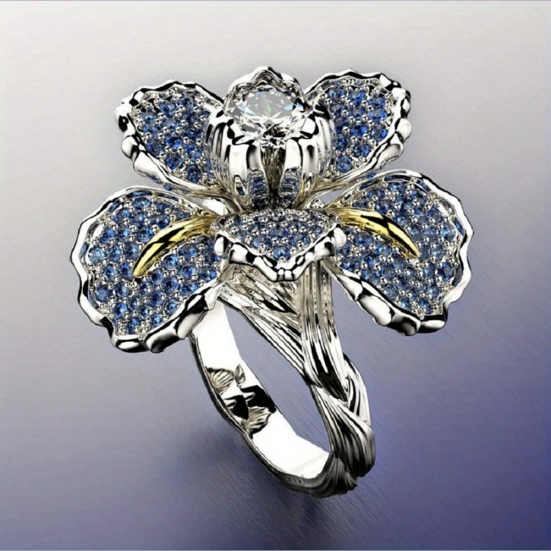 Bague avec fleurs bleues et cristal en or blanc