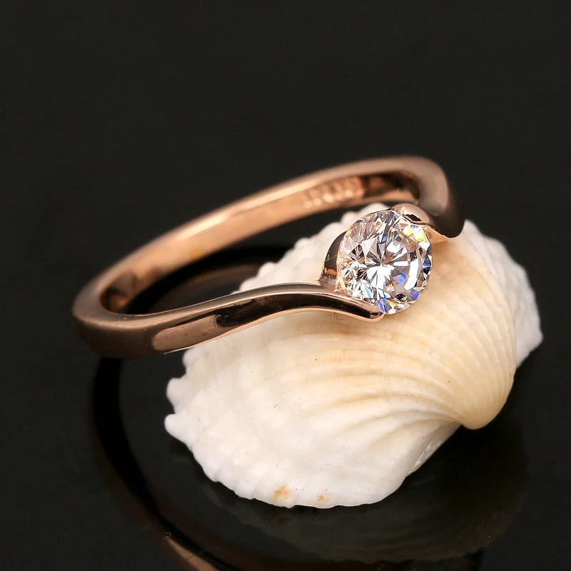 Bague rétro avec solitaire et diamants ronds en or rose