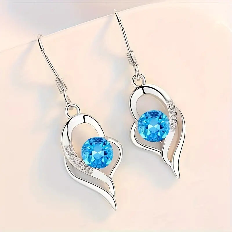 Boucles d'oreilles Éclipse goutte de cœur en or blanc