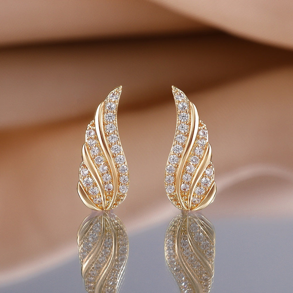 Boucles d'oreilles feuille moderne pavée en or