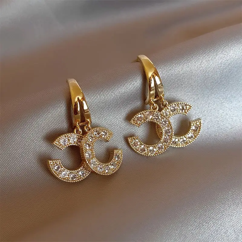 Boucles d'oreilles signature brillantes en or