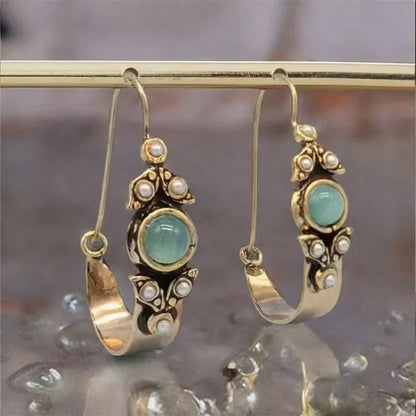 Boucles d'oreilles au style ethno-rétro avec pendentif