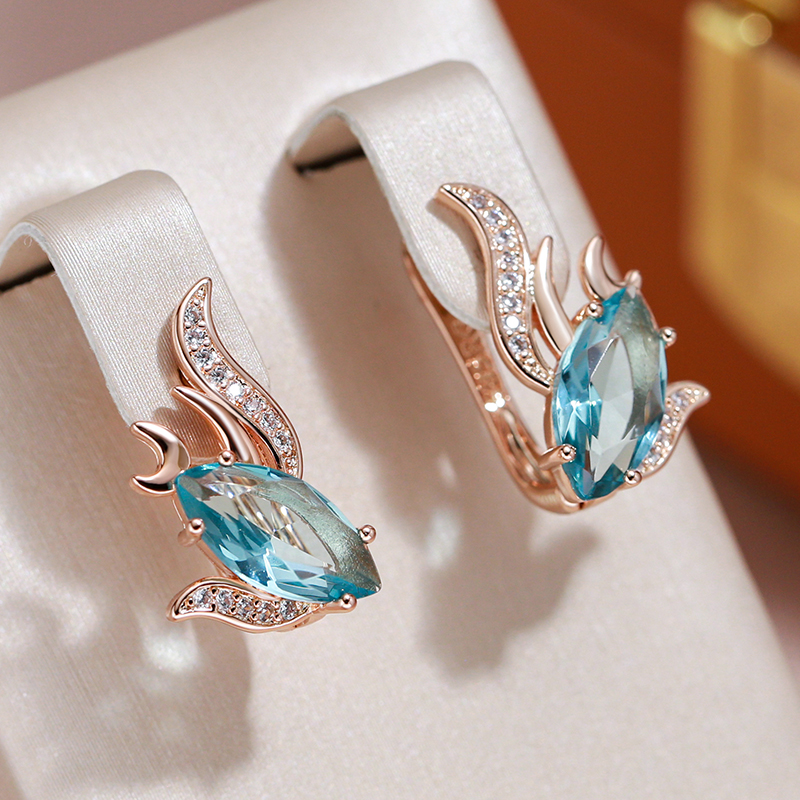 Boucles d'oreilles avec des cristaux turquoise en or