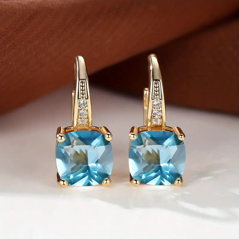 Boucles d'oreilles créoles en pierre de saphir mystique en or