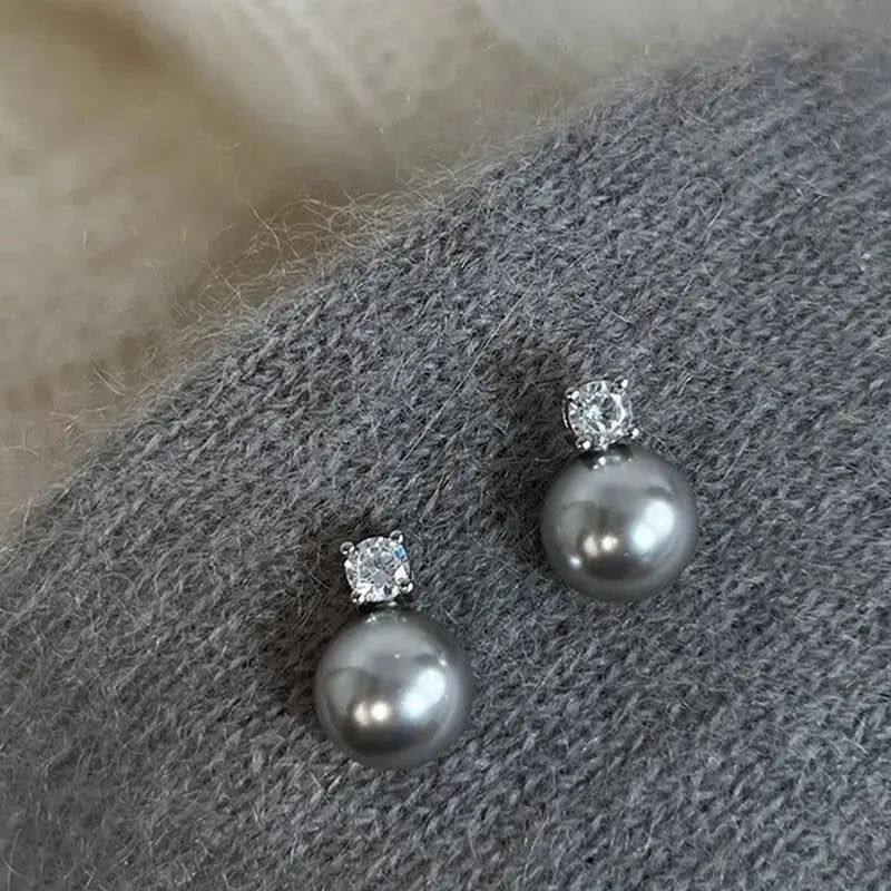 Boucles d'oreilles élégantes en perles noires à brillants en or