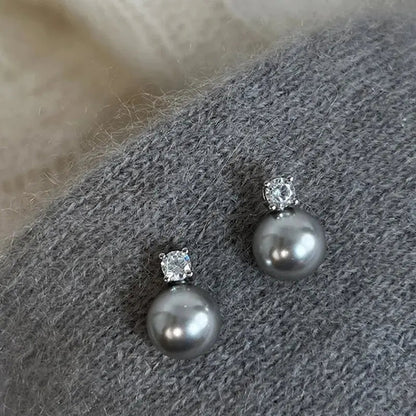 Boucles d'oreilles élégantes en perles noires avec zirconium
