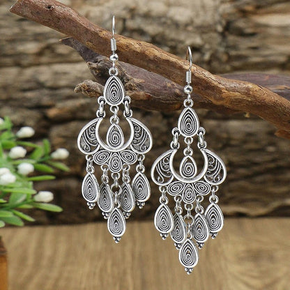 Boucles d'oreilles en argent antique avec pendentif