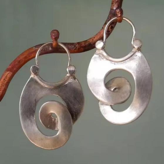 Boucles d'oreilles en argent vintage avec spirale