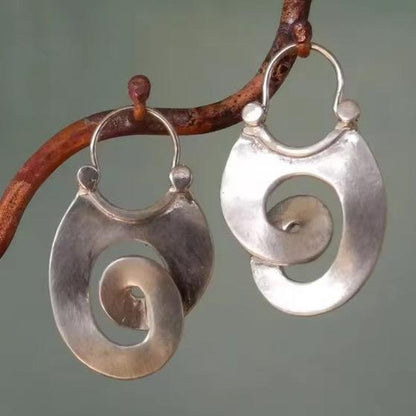 Boucles d'oreilles en argent vintage avec spirale