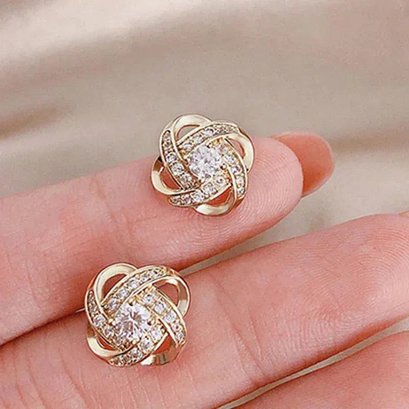 Boucles d'oreilles en forme de croix avec motif floral en or