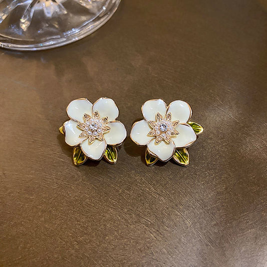 Boucles d'oreilles en or blanc avec zircon