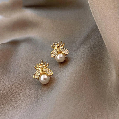 Boucles d'oreilles en perle et zircon dorées