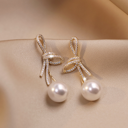Boucles d'oreilles en perles avec bande brillante en or