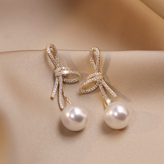 Boucles d'oreilles en perles avec bande brillante en or