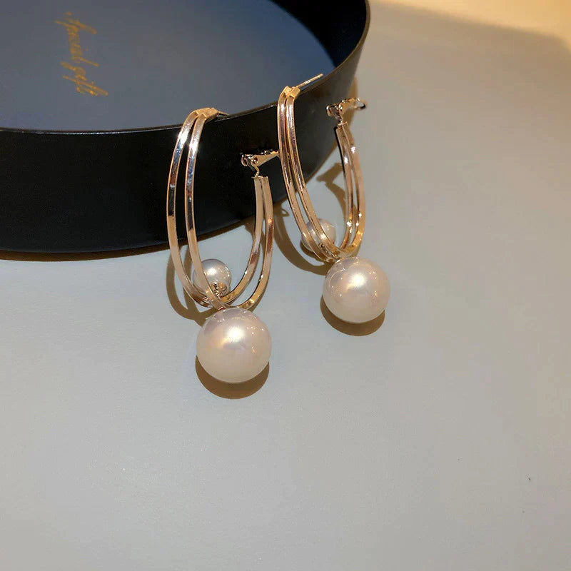 Boucles d'oreilles fascinantes avec perles en or