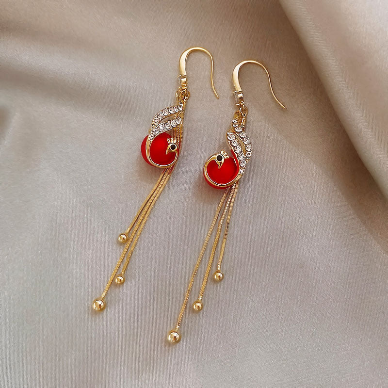 Boucles d'oreilles festives avec des marguerites bleues en or