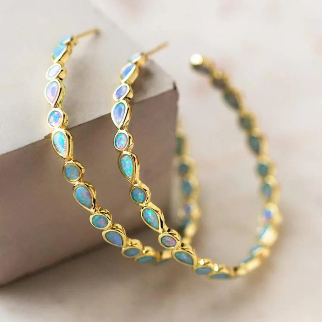 Boucles d'oreilles rétro avec opale bleue en or