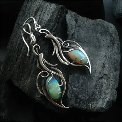 Boucles d'oreilles rétro en argent avec opale bleue