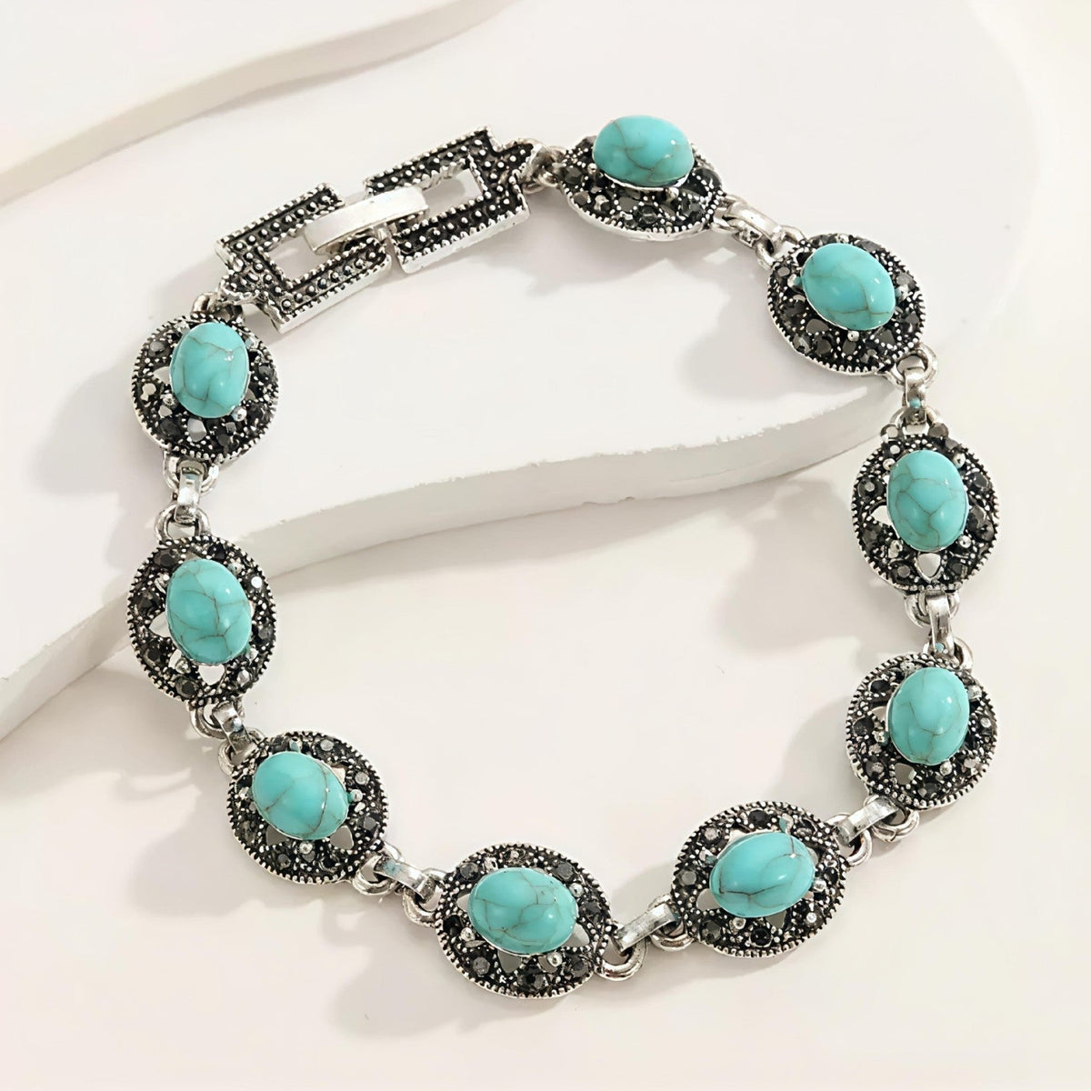 Bracelet emblème noble Corvelle en or blanc