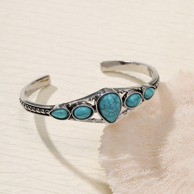 Bracelet ouvert en forme de goutte d'eau turquoise en or blanc