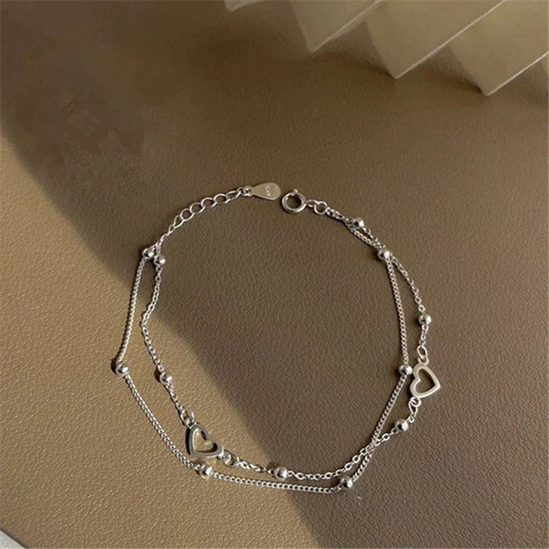 Bracelet ajustable avec cœur en or blanc
