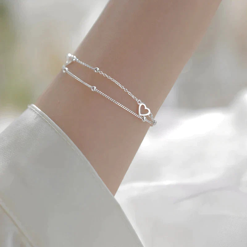 Bracelet ajustable avec cœur en or blanc
