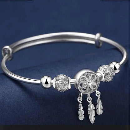 Bracelet ajustable avec médaille à trois feuilles en argent