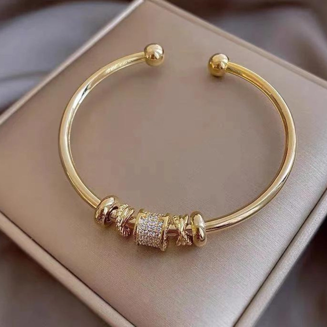 Bracelet ajustable avec pendentifs en or