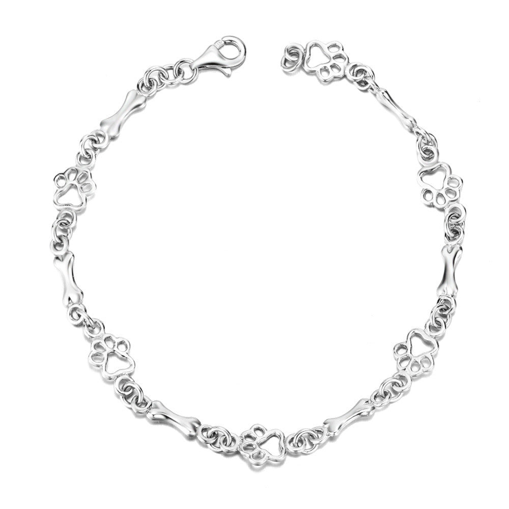 Bracelet avec pattes de chien suspendues et Os Brut, Édition limitée en or blanc