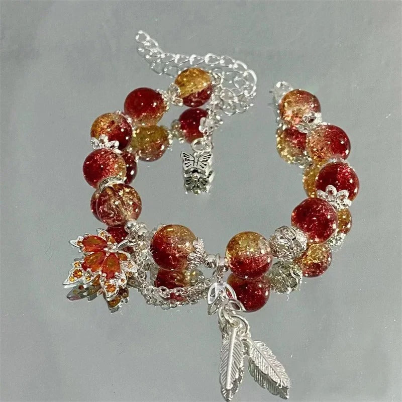 Bracelet avec feuille d'automne et papillon en or blanc