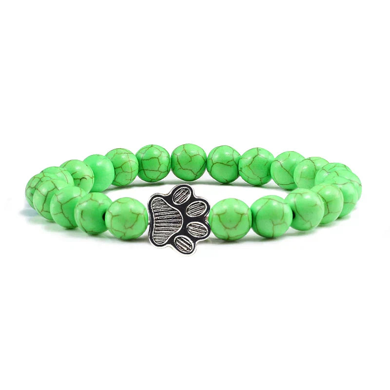 Bracelet avec perles en forme de pattes, motif en pierre naturelle en or