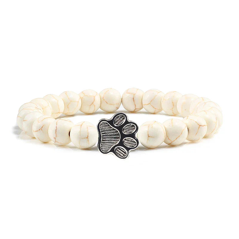 Bracelet avec perles en forme de pattes, motif en pierre naturelle en or