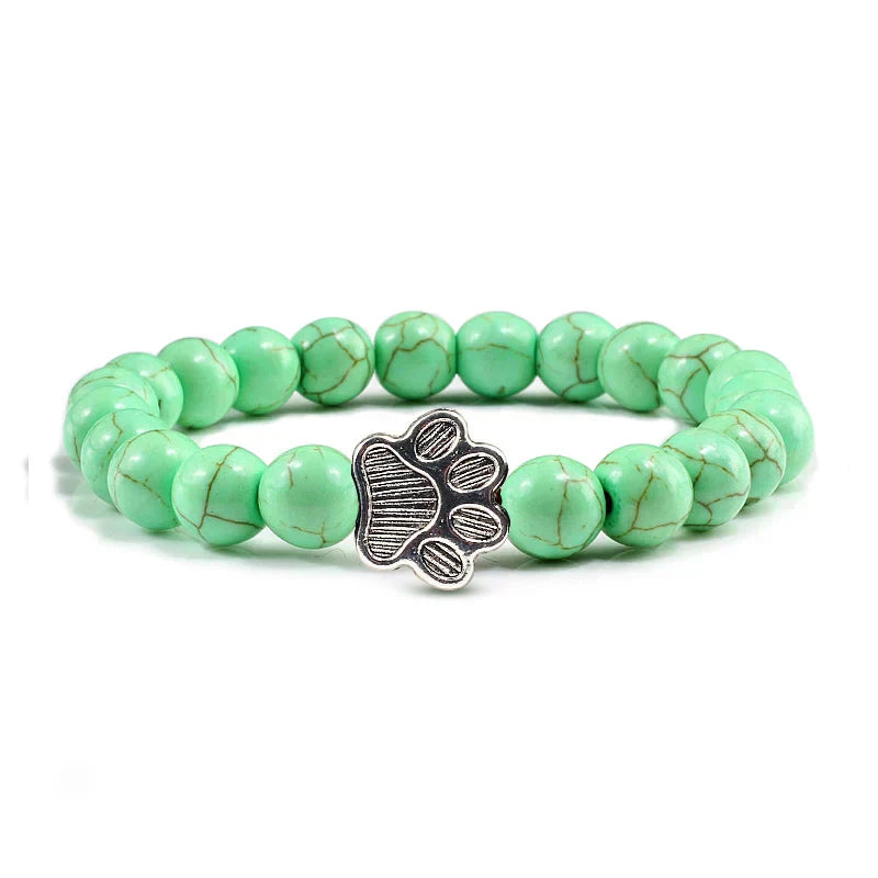 Bracelet avec perles en forme de pattes, motif en pierre naturelle en or