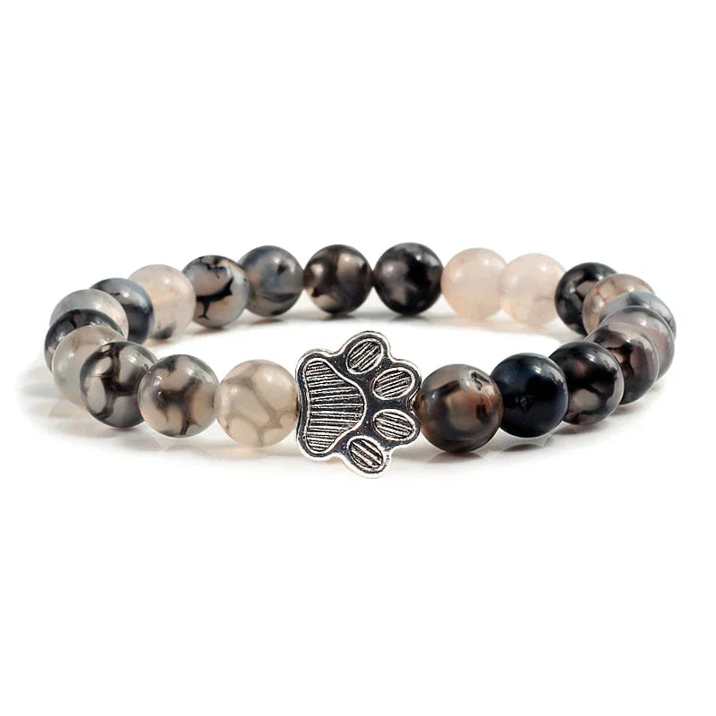 Bracelet avec perles en forme de pattes, motif en pierre naturelle en or