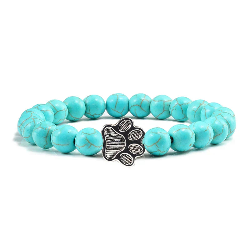 Bracelet avec perles en forme de pattes, motif en pierre naturelle en or
