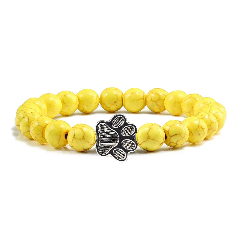 Bracelet avec perles en forme de pattes, motif en pierre naturelle en or