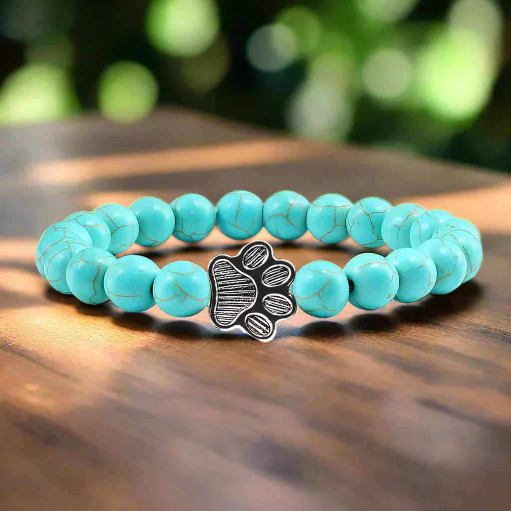 Bracelet avec perles en forme de pattes, motif en pierre naturelle en or