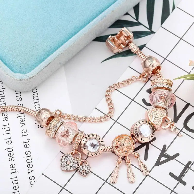 Bracelet capteur de rêves rose avec pendentifs en or blanc