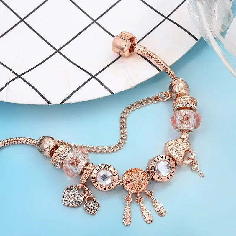 Bracelet capteur de rêves rose avec pendentifs en or blanc