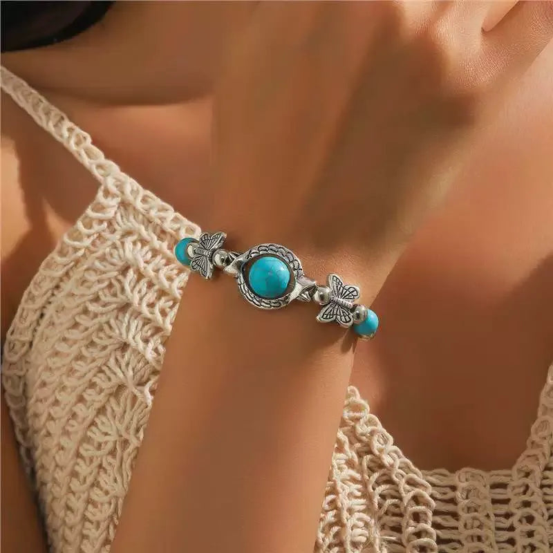 Bracelet avec des papillons en or blanc