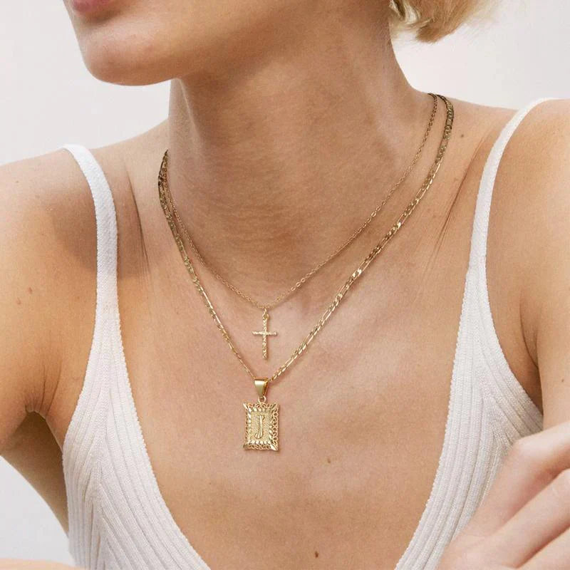Collier initial croisé en or