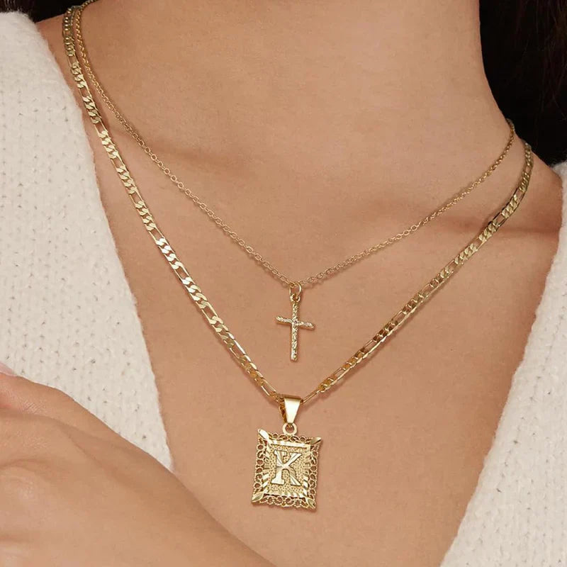 Collier initial croisé en or