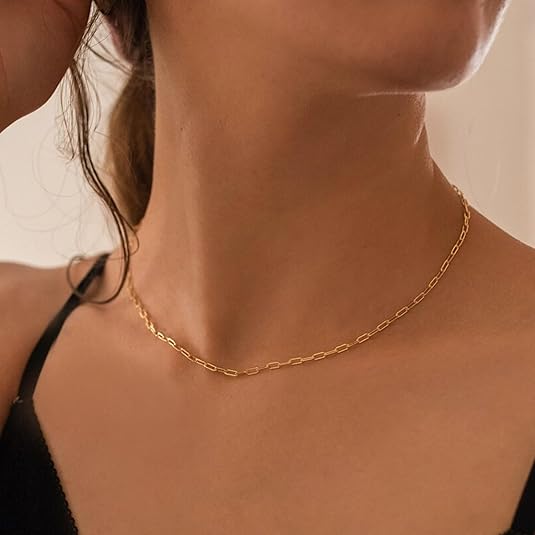Collier en rubis superposé avec Trombone en or